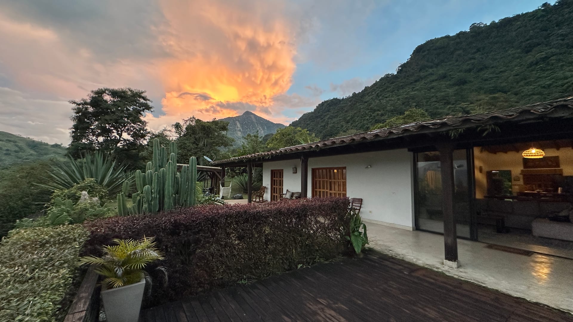 Estate house at sunset with mountain backdrop